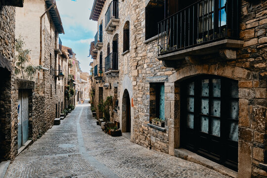 Strolling through the narrow cobbled street at Ainsa village, Aragon, Spain