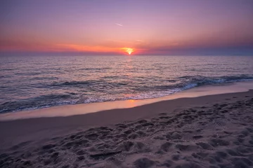 Fotobehang Słońce zachodzi nad morzem tyrreńskim  © Arsky