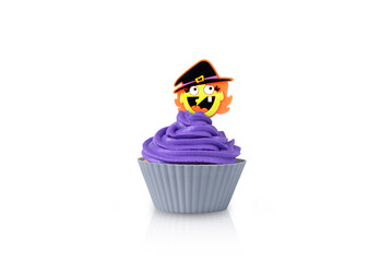 Cupcake with purple cream in grey form with witch decor isolated on a white background