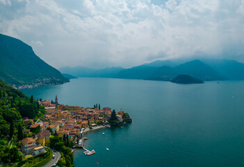 Fototapeta na wymiar Aerial view of Varenna village. Varenna is a picturesque and traditional village on a cloudy day, located on the eastern shore of Lake Como, Italy