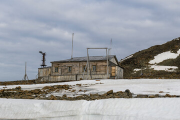 Russian research and polar expedition base in Tikhaya Bay (Tikhaya Bukhta) on Franz Josef Land archipelago. Wooden buildings in Arctic.