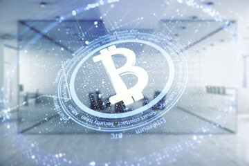 Double exposure of creative Bitcoin symbol hologram on a modern furnished office interior background. Mining and blockchain concept