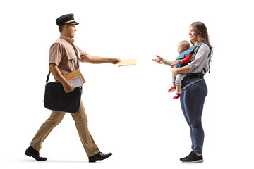 Fototapeta premium Full length profile shot of a mailman delivering letter to a mother with a baby