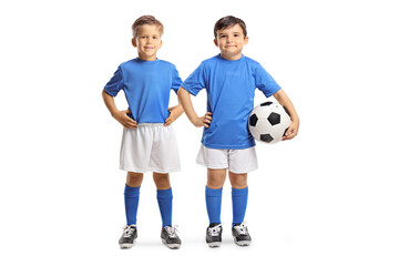 Boys with a soccer ball posing and smiling at camera