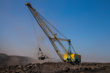 Fototapeta na wymiar walking excavator in a coal mine