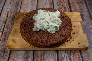 Baking of brown cream fruit cake with apricot and marijuana butter