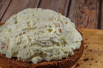 Baking of brown cream fruit cake with apricot and marijuana butter