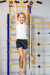 little girl go in for sports. The concept of active play in the home room, quarantine, self-isolation