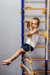 little boy. The concept of active play in the home room, quarantine, self-isolation