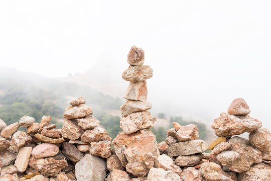 Stones stacked in pile in foggy highland