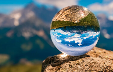 Crystal ball alpine landscape shot at the famous Rossbrand summit near Filzmoos, Salzburg, Austria