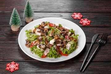 Tasty fresh salad prepared for the Christmas table