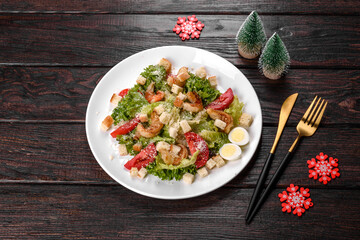 Tasty fresh salad prepared for the Christmas table