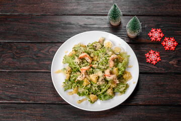 Tasty fresh salad prepared for the Christmas table
