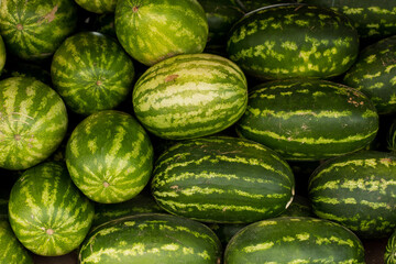 Piled watermelon background in a market