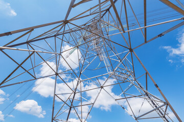 High-voltage tower on the day sky background.