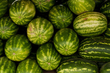 Piled watermelon background in a market