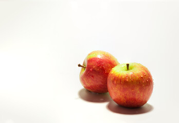 fresh red apples with drops isolated on the white background with copy space