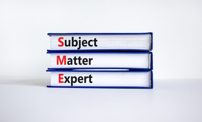 SME, subject matter expert symbol. Concept words SME, subject matter expert on books on a beautiful white background. Business, SME, subject matter expert concept. Copy space.