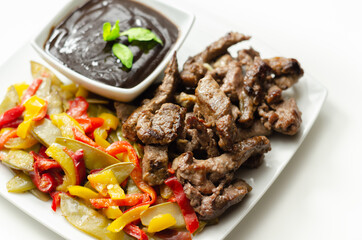 Beef strips with mixed peppers and mangetout served with black bean sauce