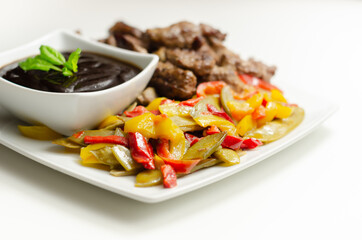 Beef strips with mixed peppers and mangetout served with black bean sauce