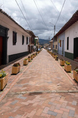 Nemocon, Cundinamarca, Colombia. July 2, 2021: Colorful facade and architecture of city houses.