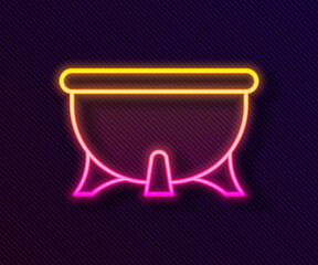 Glowing neon line Halloween witch cauldron icon isolated on black background. Happy Halloween party. Vector