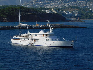 Fototapeta na wymiar A luxury yacht near the coast of Vouliagmeni in Attica, Greece
