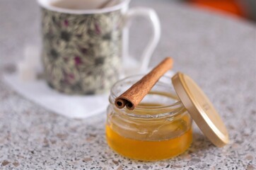 Closeup cup of tea and honey in a jar sweet food eat yummy natural healthy organic beverage delicious breakfast morning