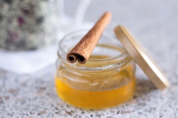 Closeup cup of tea jar of honey and cinnamon on the table healthy hot sweet yummy organic food eat nobody dessert