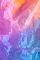 Abstract background with crumpled paper in neon gradient. Vivid blue, pink and orange colors