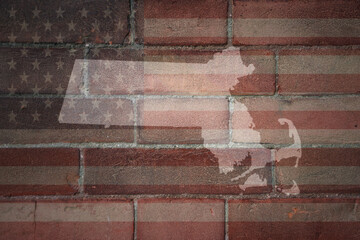 map of massachusetts state on a painted flag of united states of america on a brick wall