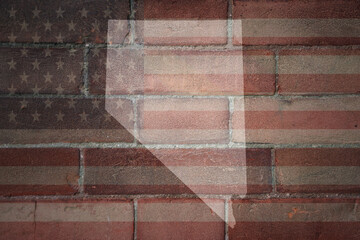 map of nevada state on a painted flag of united states of america on a brick wall