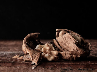 Tasty walnut cracked walnut closeup dark background