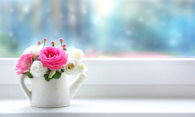 Flowers in vase on windowsill with empty copy space. Mother's day decoration, valentine's day card.Birthday present. 8 march bouquet. Winter romantic evening.