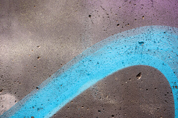 texture of concrete close up with colourful graffiti