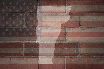 map of vermont state on a painted flag of united states of america on a brick wall