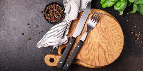 wooden serving board and cutlery fork and knife zero waste meal on the table copy space food...