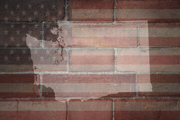 map of washington state on a painted flag of united states of america on a brick wall