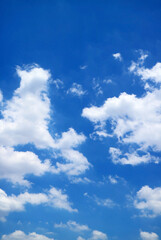 Pure White Clouds Floating on Vivid Blue Sunny Sky