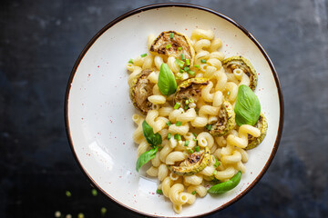 pasta zucchini vegetable macaroni no meat fresh ready to eat meal snack on the table copy space food background rustic. top view diet veggie vegan or vegetarian food
