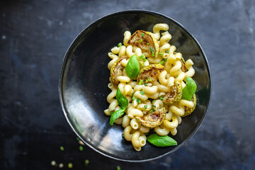 pasta zucchini vegetable macaroni no meat fresh ready to eat meal snack on the table copy space food background rustic. top view diet veggie vegan or vegetarian food