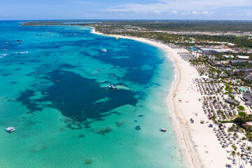 Obraz na płótnie Canvas Aerial view from drone on caribbean beach of Atlantic ocean with luxury resorts, travel destination