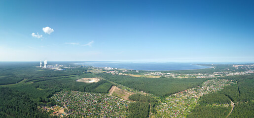 Smoking cooling towers at nuclear power plant. Aerial panorama view