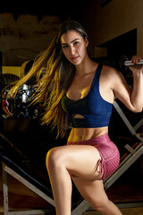 Fototapeta na wymiar latina woman at the bodybuilding gym