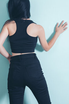 Young Woman In Jeans From Behind