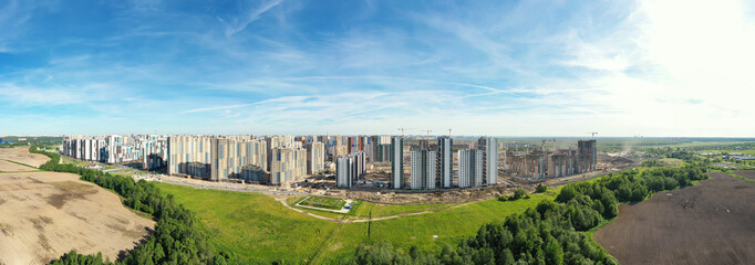 Ready houses and building construction site. Сity development. Aerial view