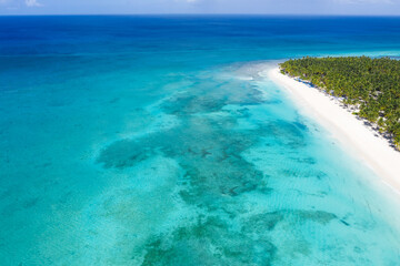 Saona island with coconut palm trees and turquoise caribbean sea. Dominican Republic. Aerial view