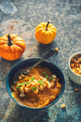 Fresh homemade pumpkin soup served with croutons, top view