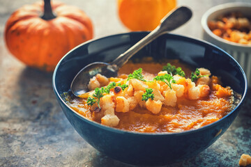 Pumpkin soup served with croutons